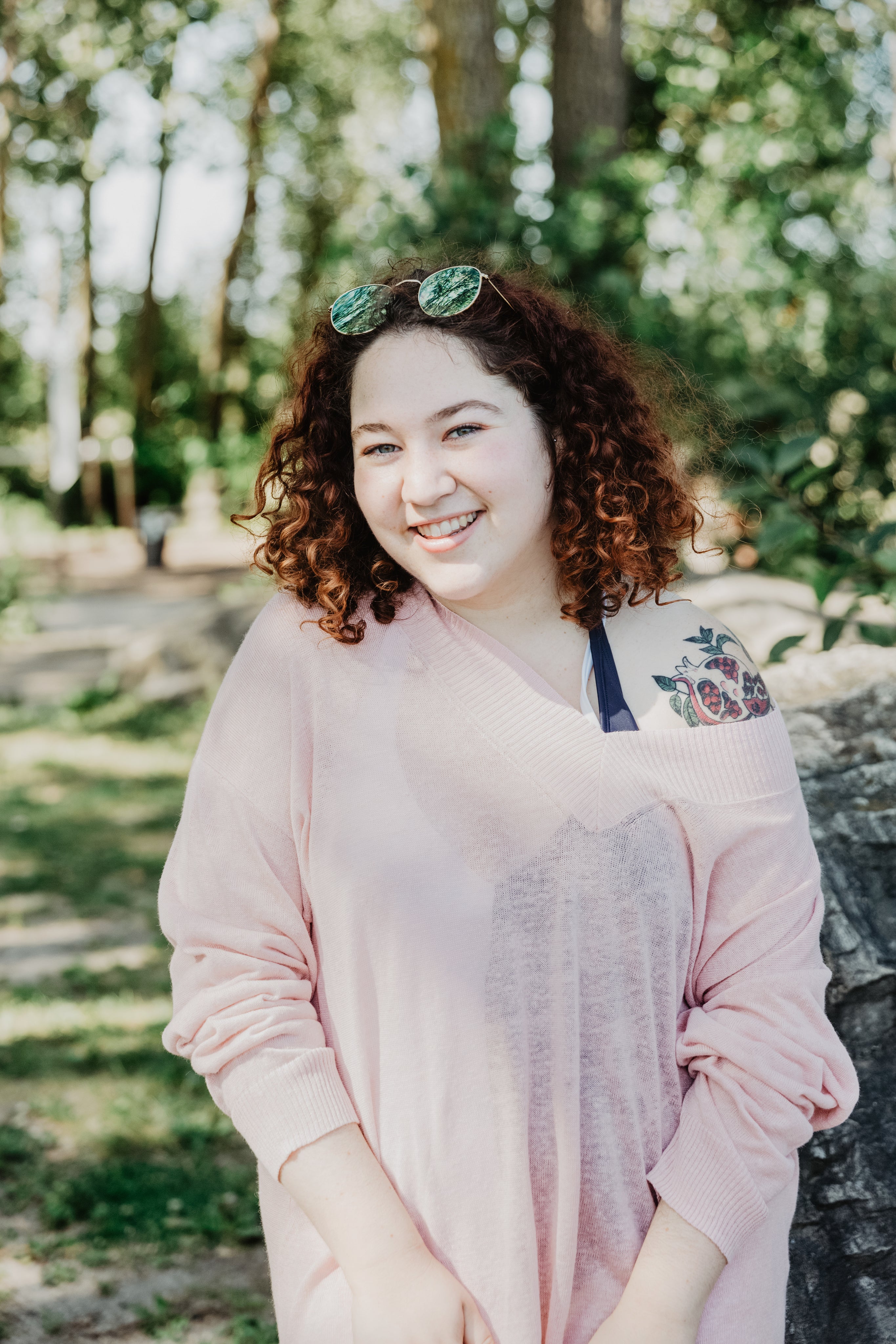 files/young-woman-with-curly-hair-smiling-bright.jpg